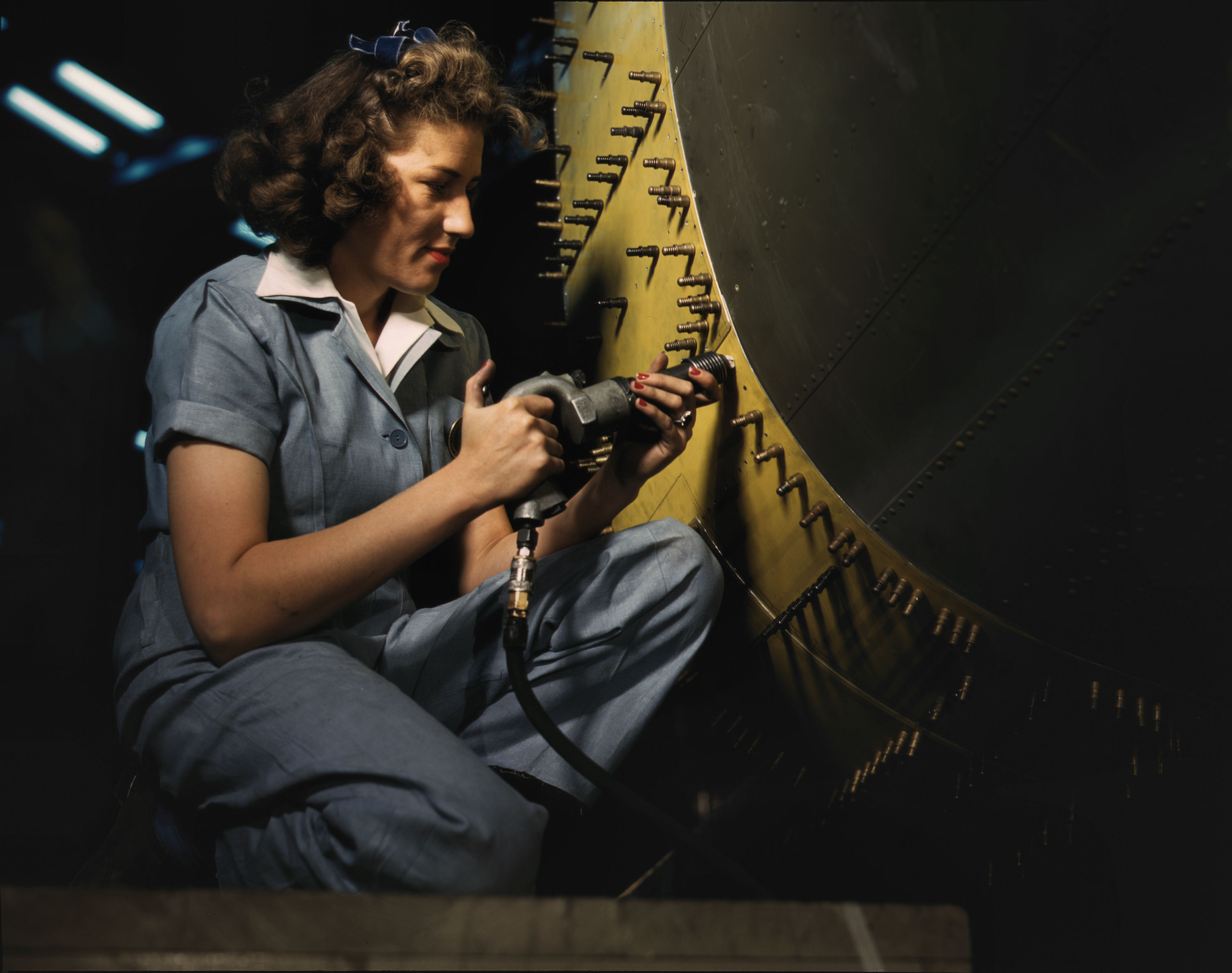 Riveter at Work on Consolidated Bomber