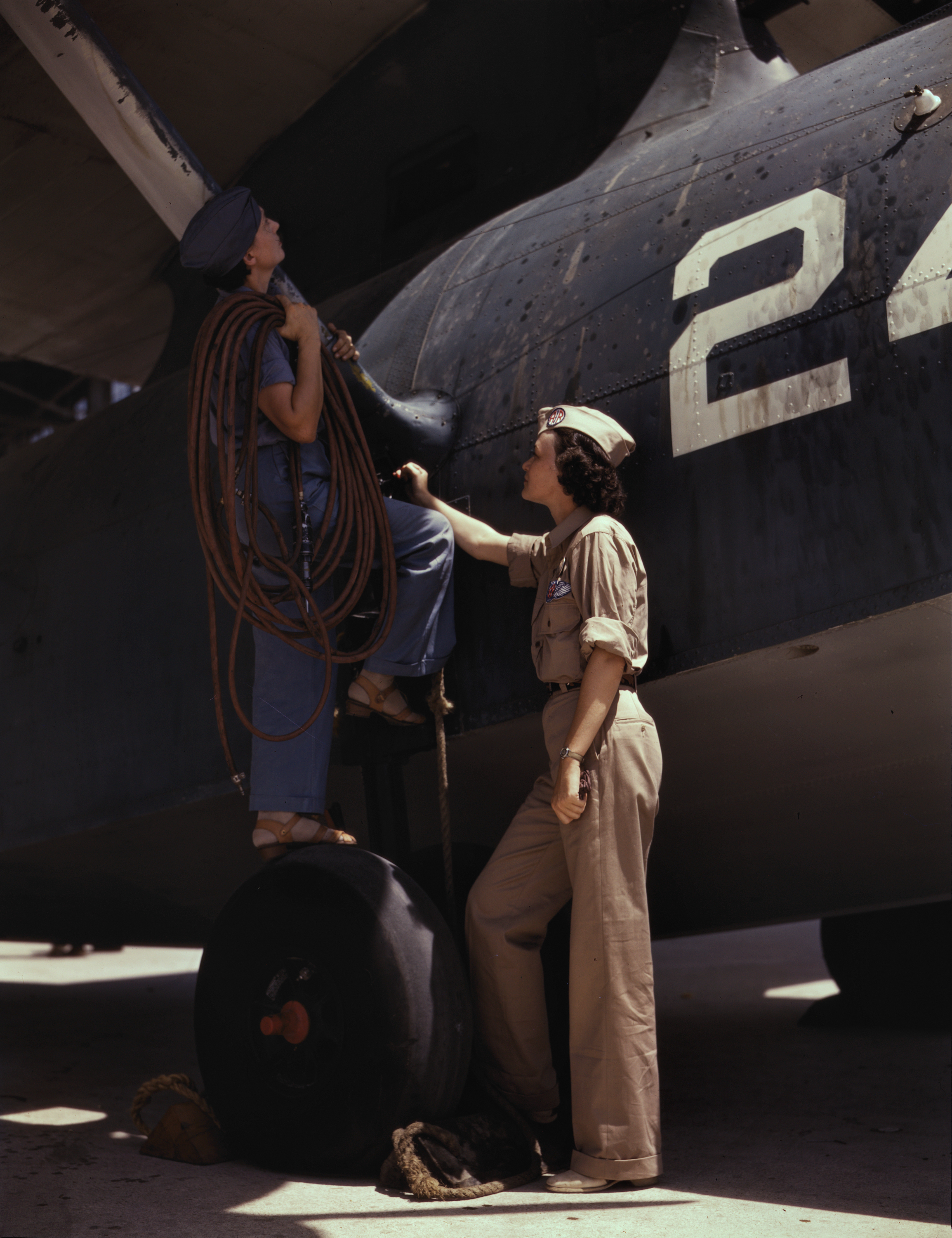 Woman Works as Cowler at Naval Air Base