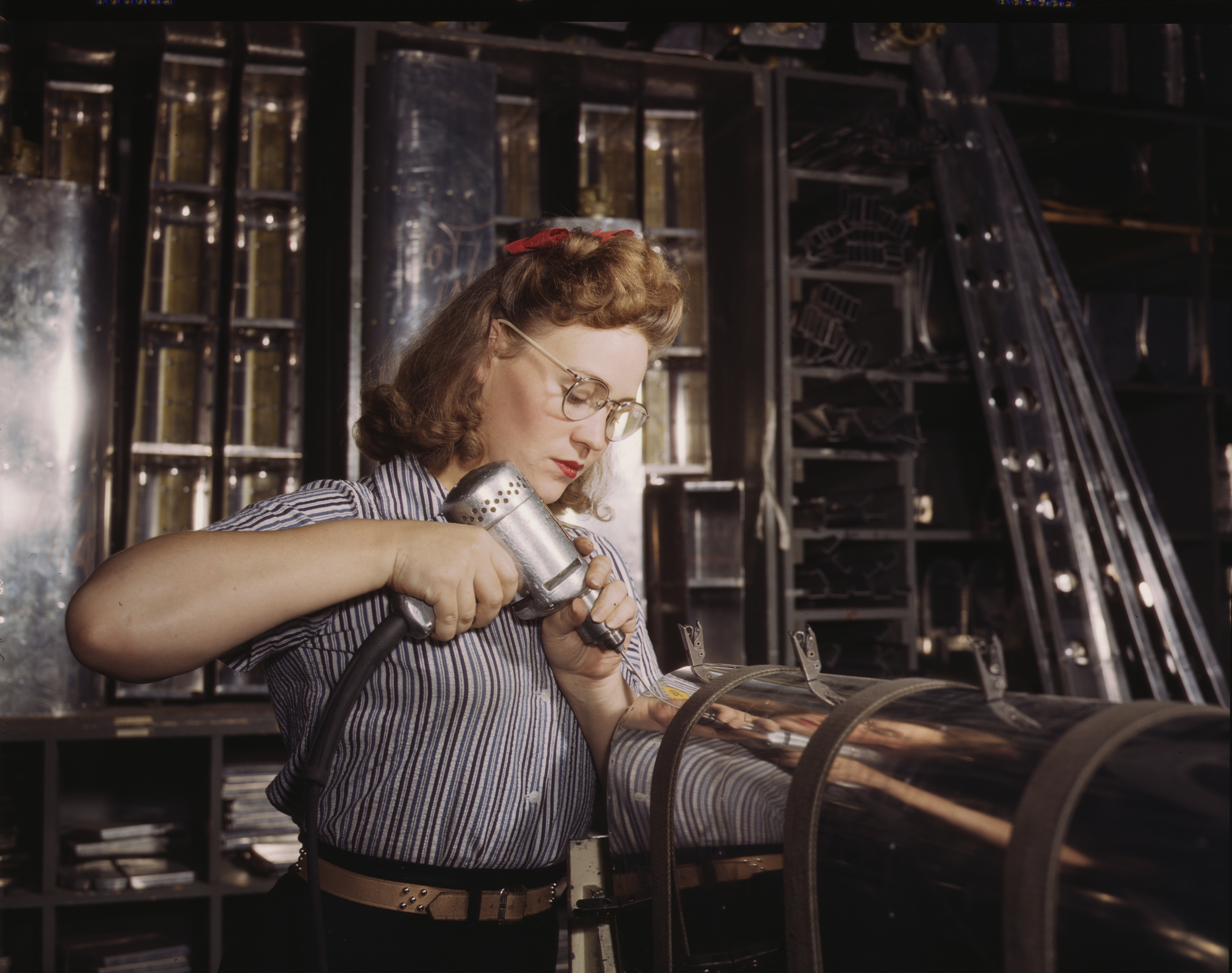 Woman Worker Assembles Aircraft Stabilizer Part