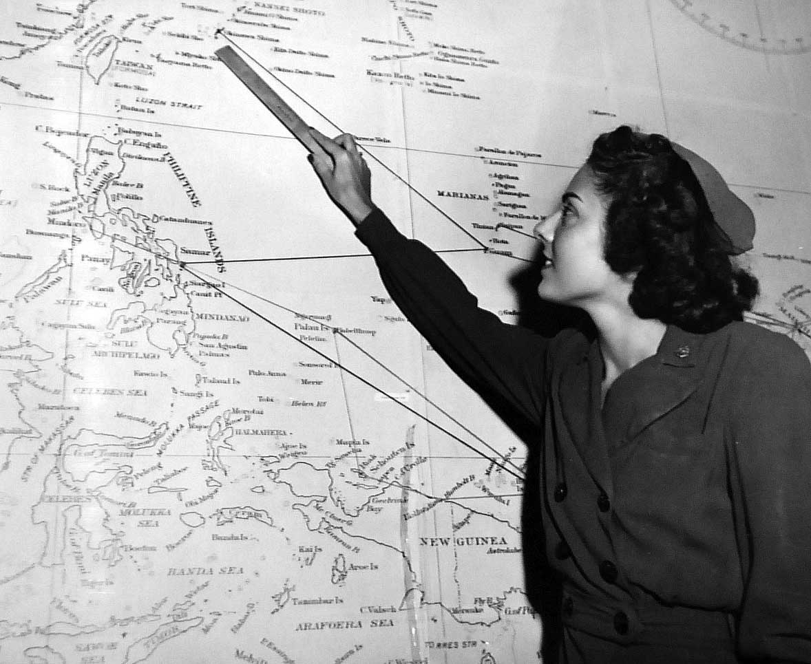 Flight Nurse Examining Map of Pacific
