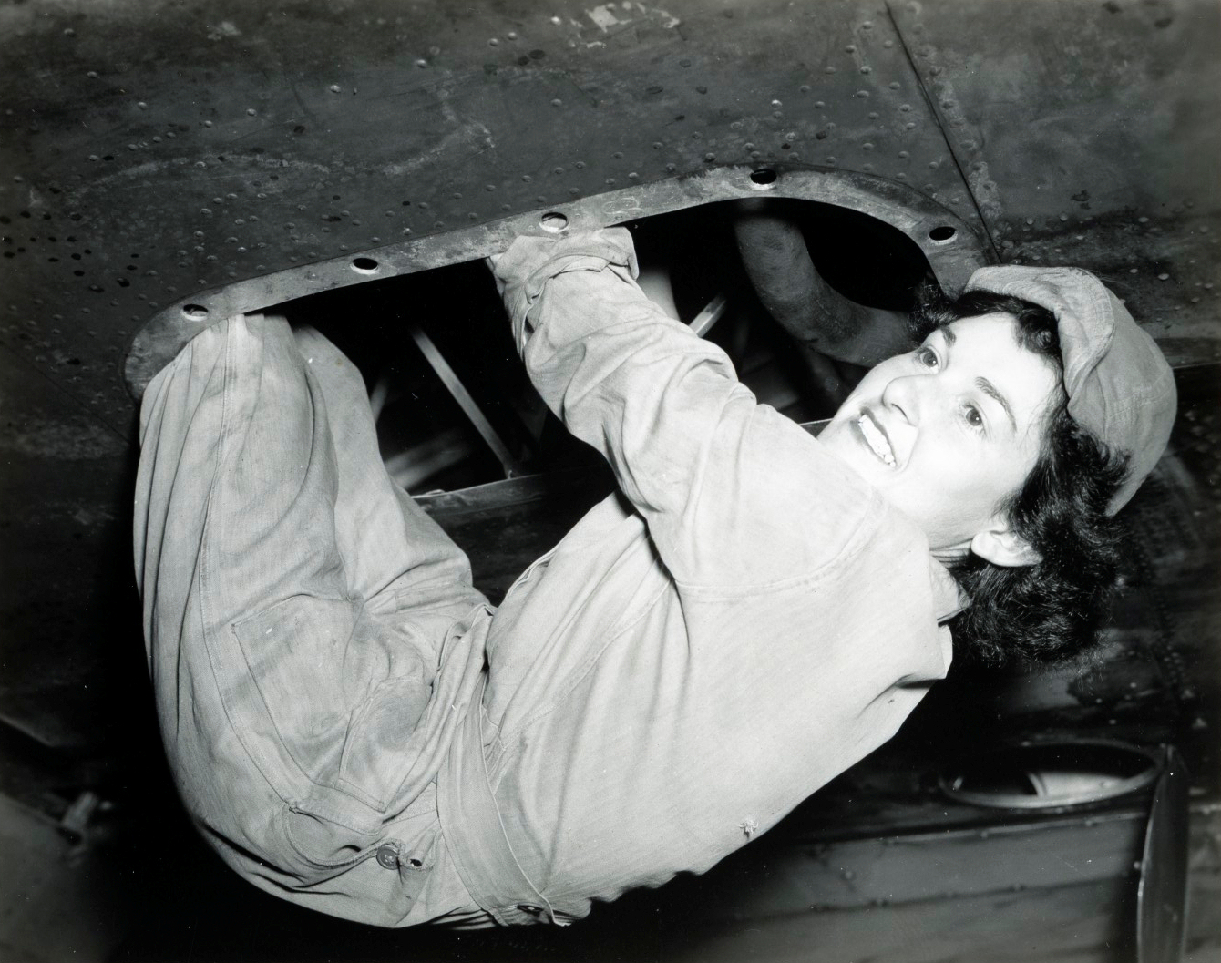 WAC Aircraft Mechanic Hanging From B-17 Wing
