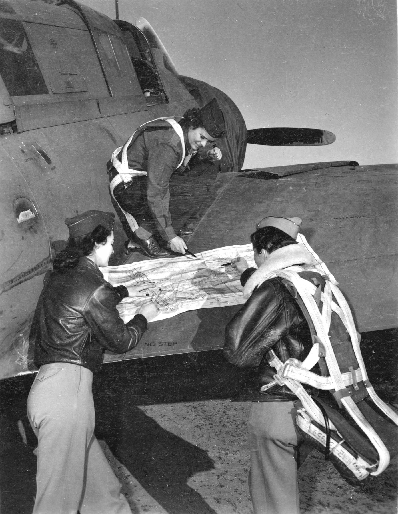 Three WASPs Check Flight Plan Before Tow Mission