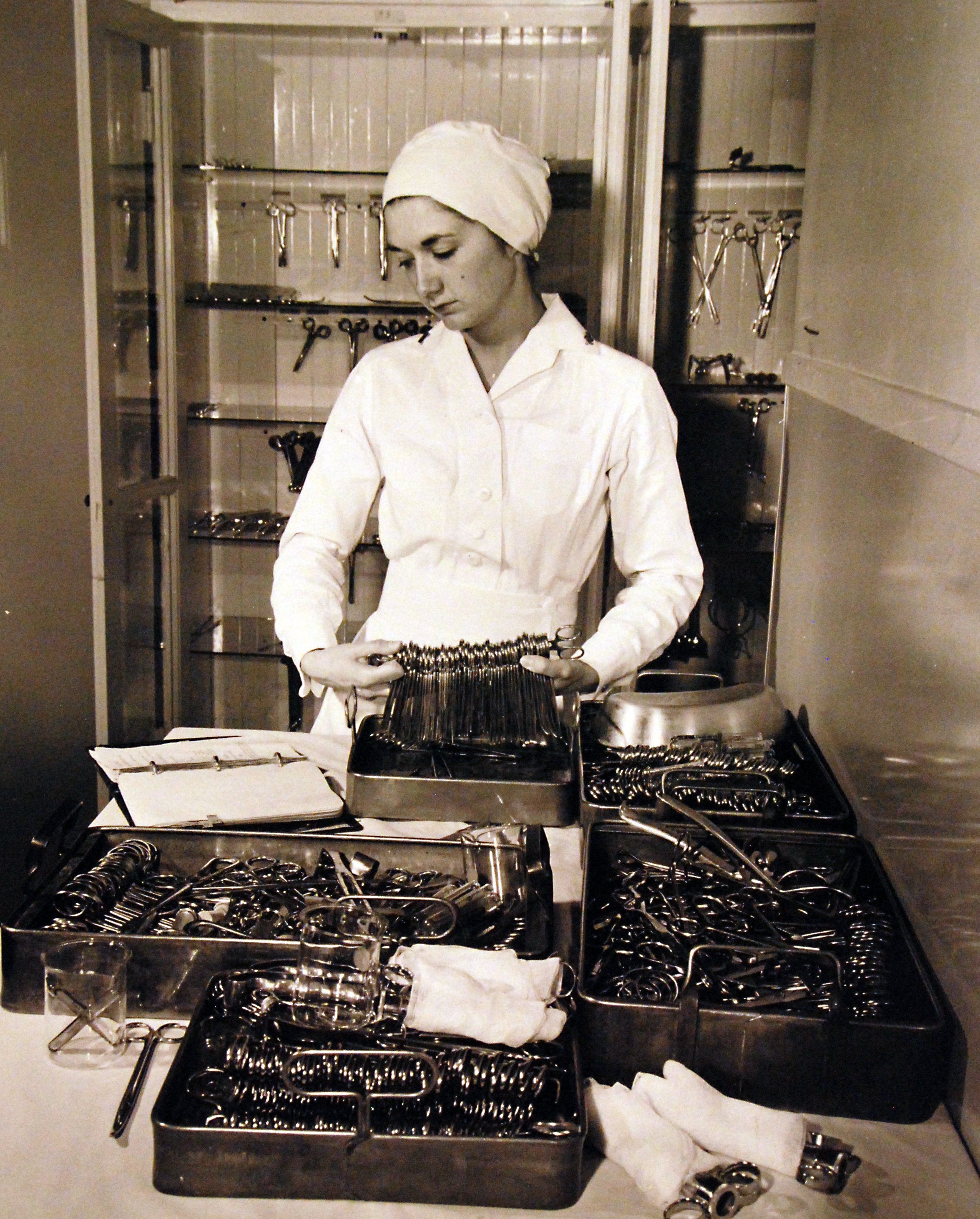 Navy Nurse Picking Instruments for Operation