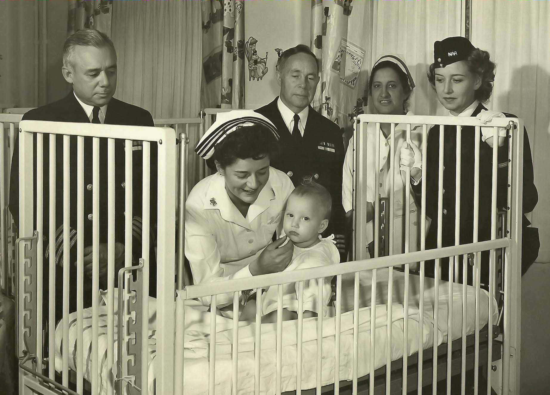 Navy Nurse Checks Baby at Naval Hospital San Diego
