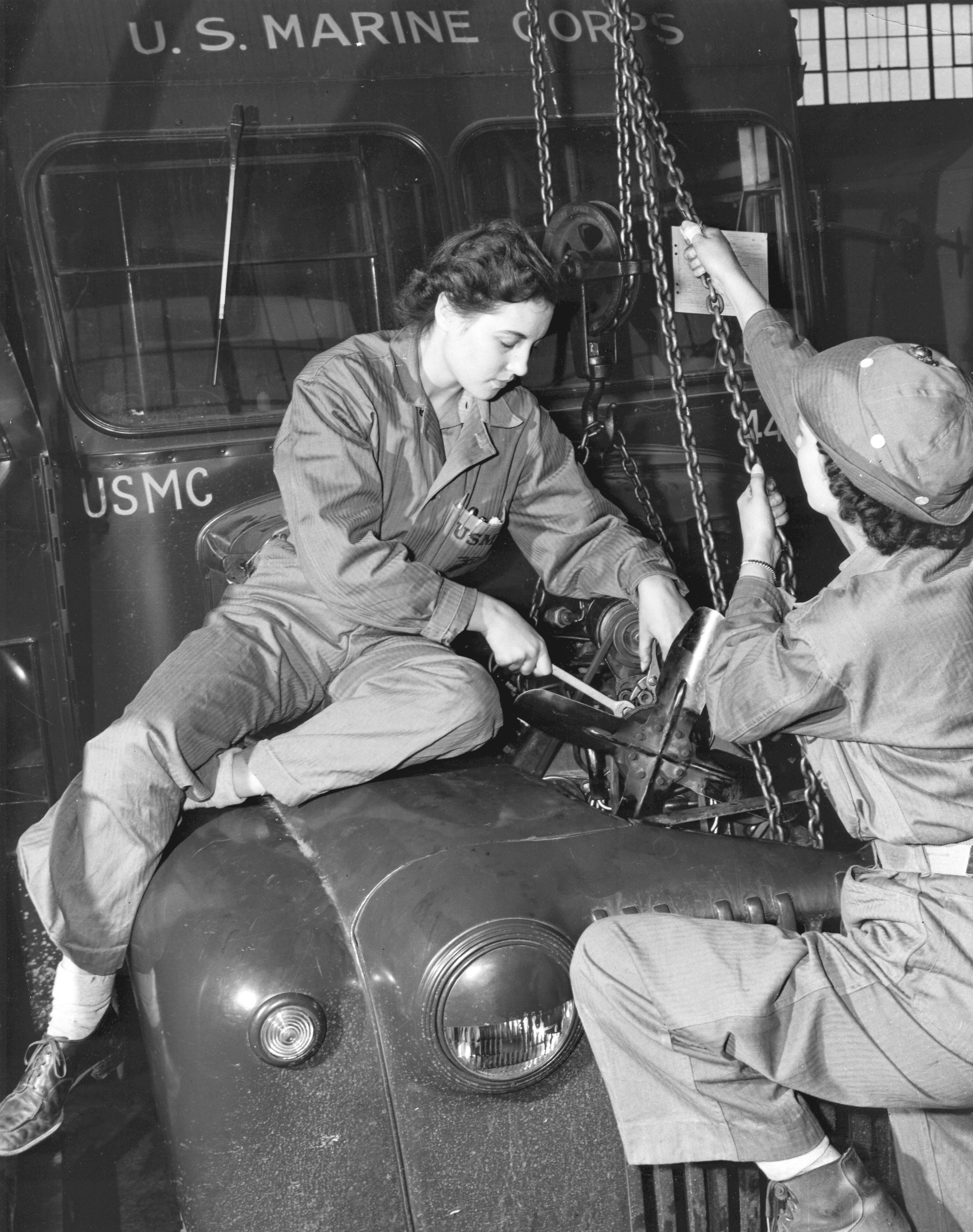 Women Mechanics Repair Marine Corps Bus Engine