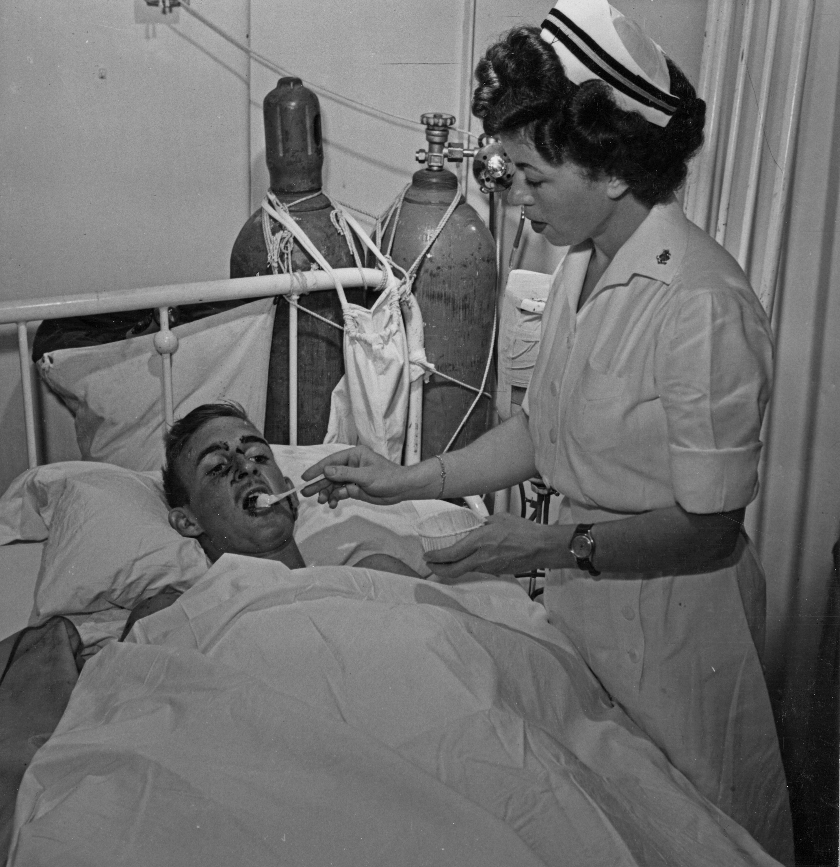 WWII Hospital Ship Nurse Feeds Patient Ice Cream