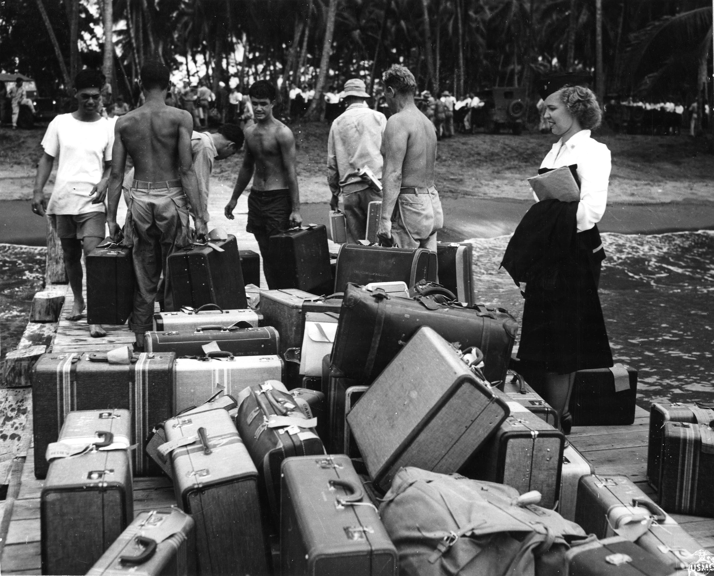 Navy Nurse Looks for Suitcase in Guadalcanal