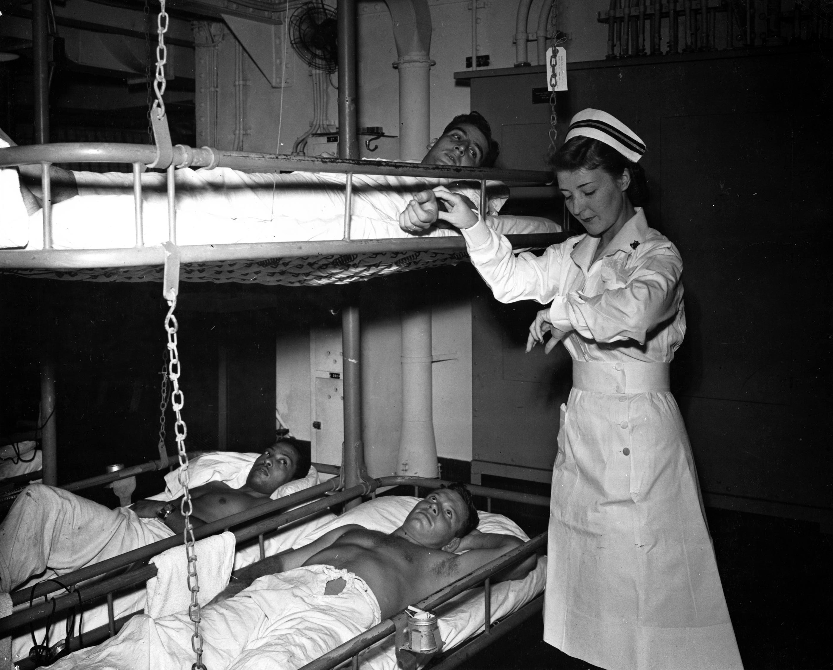 Nurse Takes Pulse of Patient on Hospital Ship