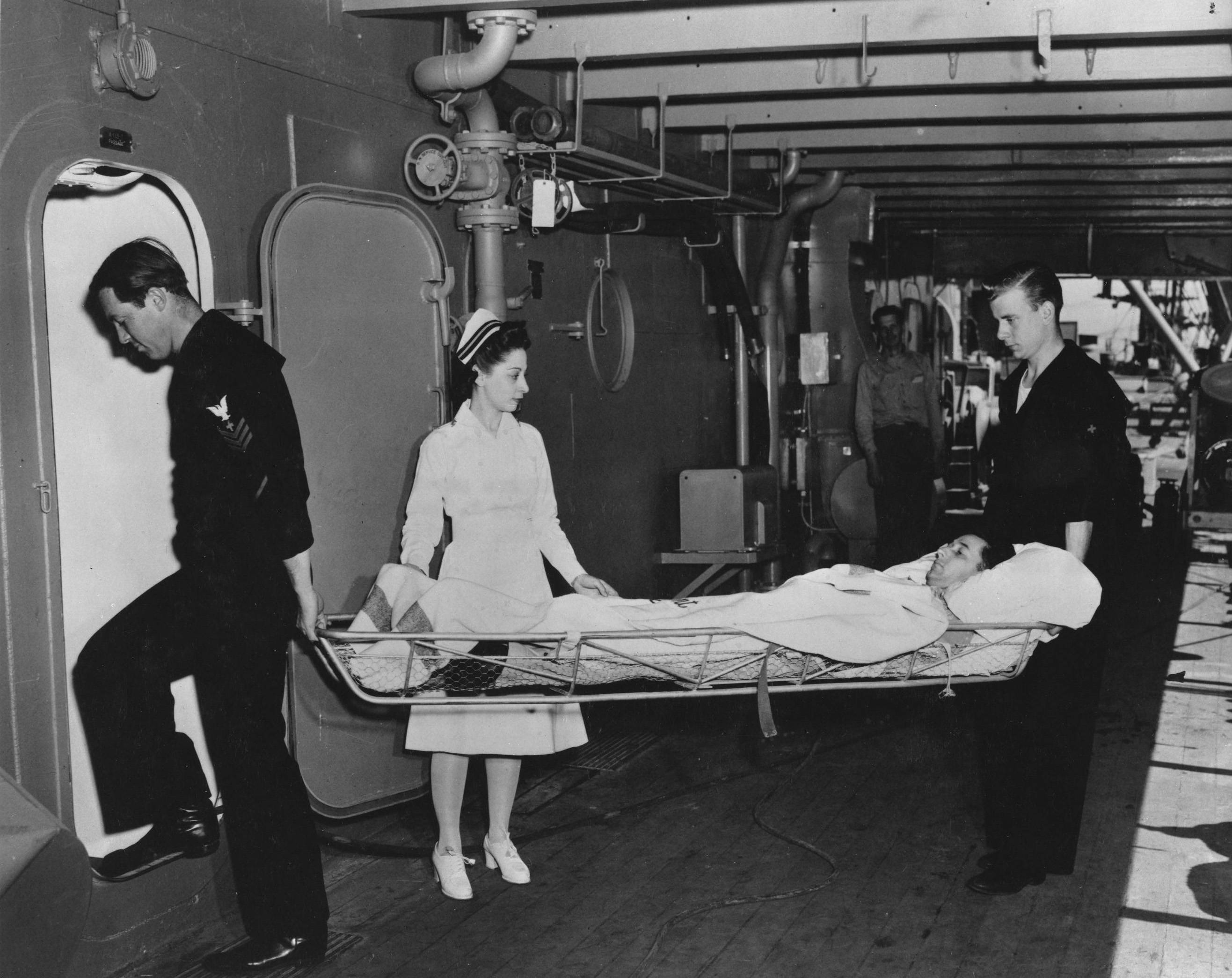 Nurse Watches Wounded Being Brought Aboard Ship