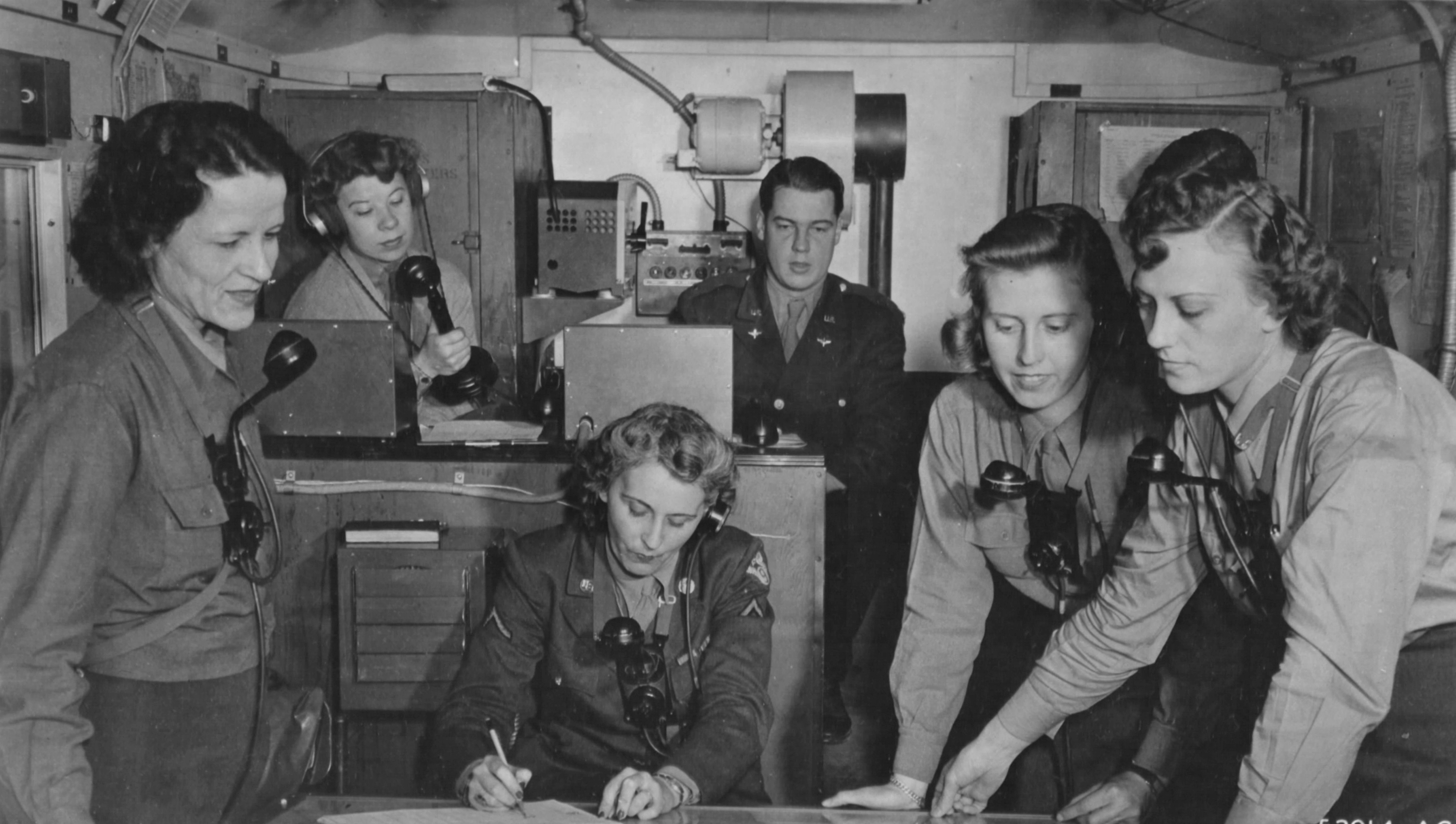 WACs Give Directions to Bombers Returning from Missions