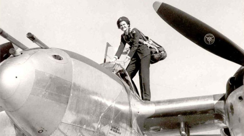 WASP Pilot Climbs Into a P-38 Aircraft