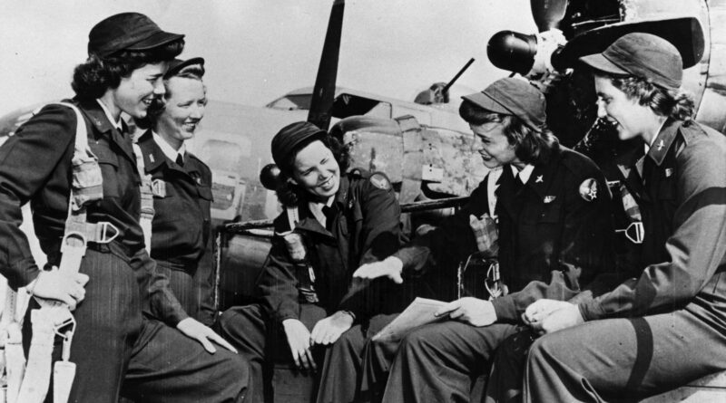 Group of Women Airforce Service Pilots (WASP) on the airfield.