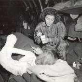 Flight Nurse Cares for Wounded on Trip from Iwo Jima Flight Nurse Cares for Wounded on Trip from Iwo Jima